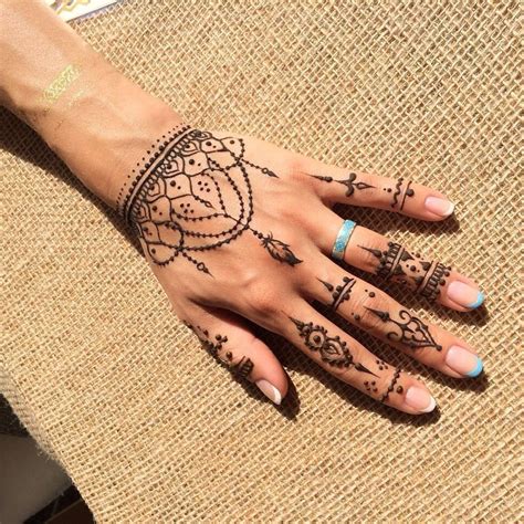 While a painful place to get tattooed, the finger can be a classy placement with sentimental artwork. . Boho finger tattoos